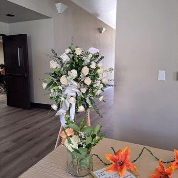 Renaissance Flower Shop - This white spray stand for a funeral service. - Flowers & Gifts Near Me - Pomona, California Renaissance Flower Shop - This white spray stand for a funeral service. - Flowers & Gifts Near Me - Pomona, California