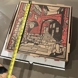 a pizza box with a drawing of a man on a bicycle