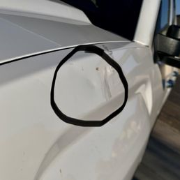 The main dent damage caused by my sloppy neighbors on my new me cherry GMC Sierra.