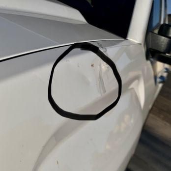 Sol Paintless Dent Repair - The main dent damage caused by my sloppy neighbors on my new me cherry GMC Sierra. - Mobile Dent Repair Near Me