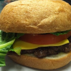 Uncle Tony's - Chela Angus Cheeseburger on white sourdough bun.