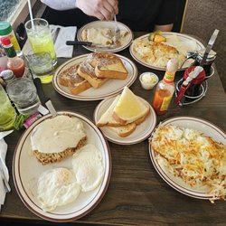 Two chicken fried steaks. 3 sides of hash browns. 4 eggs over easy. 3 sides of sourdough toast. 1 side of French toast.