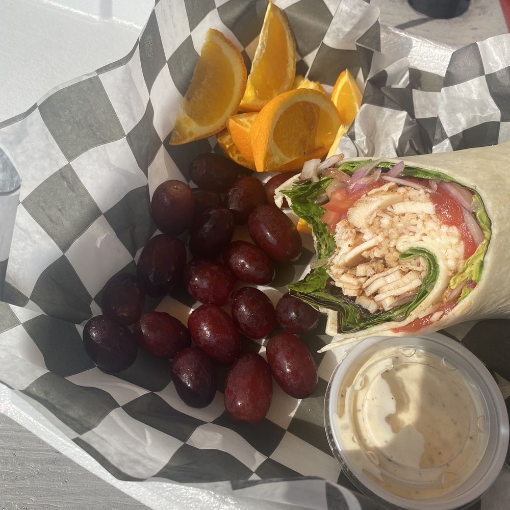 The Hibiscus Jerk Hut - Half of my Jerk Chicken Caesar Wrap - Caribbean Near Me - Springfield, Missouri The Hibiscus Jerk Hut - Half of my Jerk Chicken Caesar Wrap - Caribbean Near Me - Springfield, Missouri