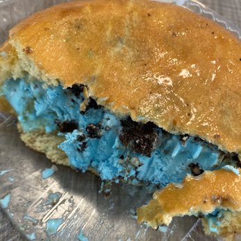 Top Donut - Creamy Bun- Crunch-a-saurus ice cream (blue vanilla) with Oreo topping and drizzled with Caramel (which absorbs into the donut). Delicious. - Donuts Near Me - Dracut, Massachusetts