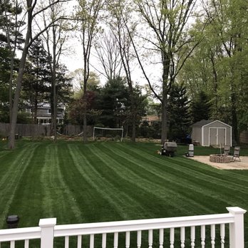 La Pista Lanscaping - a lawn with a fence and a shed in the background - Landscaping Near Me - Brentwood, New York La Pista Lanscaping - a lawn with a fence and a shed in the background - Landscaping Near Me - Brentwood, New York