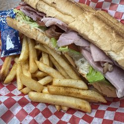 Logan Farms Honey Glazed Hams - Pig Poboy with Cajun fries