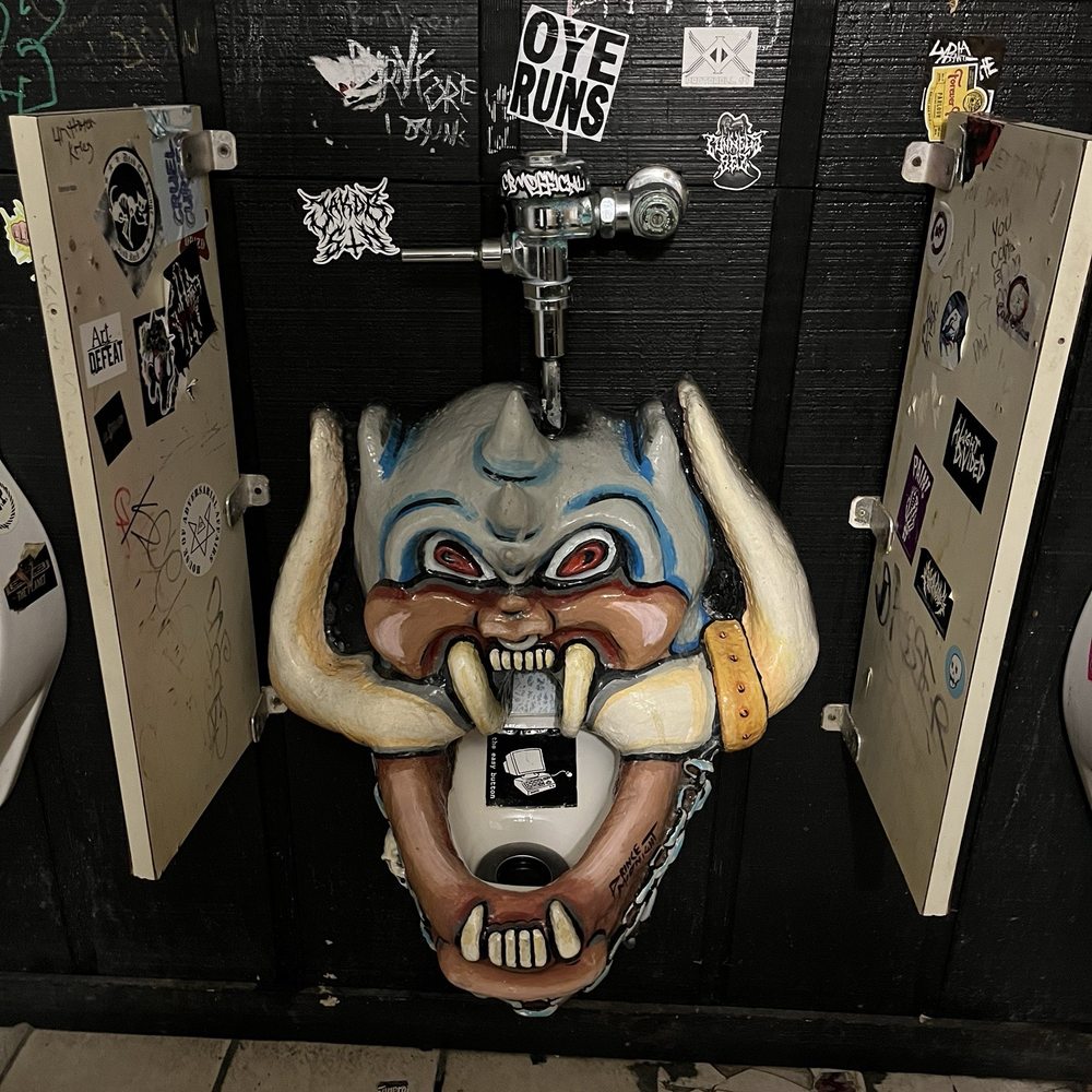 The Brass Mug - a bathroom stall with graffiti on the walls - Bars Near Me - Tampa, Florida The Brass Mug - a bathroom stall with graffiti on the walls - Bars Near Me - Tampa, Florida
