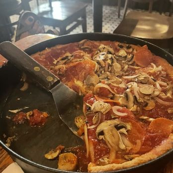 Pizzeria Uno - Medium Deep dish- 2 much for 2 people. Listen to the staff. - Pizza Near Me - Chicago, Illinois Pizzeria Uno - Medium Deep dish- 2 much for 2 people. Listen to the staff. - Pizza Near Me - Chicago, Illinois