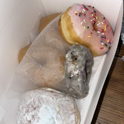 6 pack donuts: strawberry frosted, blueberry, lemon filled, and maple.