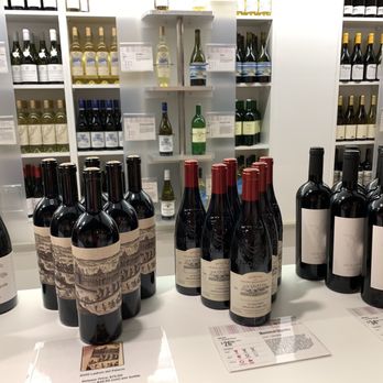 Winestore - bottles of wine on a counter - Beer, Wine & Spirits Near Me - Raleigh, North Carolina