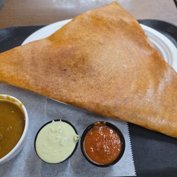 Radhe Authentic Indian Restaurant - A huge, crispy, & tasty Cheese Masala Dosa served with sambar, chutney, and yogurt sauce - Indian Near Me - Riverview, Florida Radhe Authentic Indian Restaurant - A huge, crispy, & tasty Cheese Masala Dosa served with sambar, chutney, and yogurt sauce - Indian Near Me - Riverview, Florida