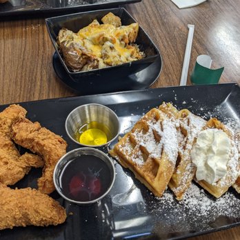 Mighty Wing Shop - December 2021; regular waffle and 3 tenders ($16); side of potatoes with added cheese and bacon ($6.50); very good and surprisingly filling. - Breakfast & Brunch Near Me - Detroit, Michigan Mighty Wing Shop - December 2021; regular waffle and 3 tenders ($16); side of potatoes with added cheese and bacon ($6.50); very good and surprisingly filling. - Breakfast & Brunch Near Me - Detroit, Michigan