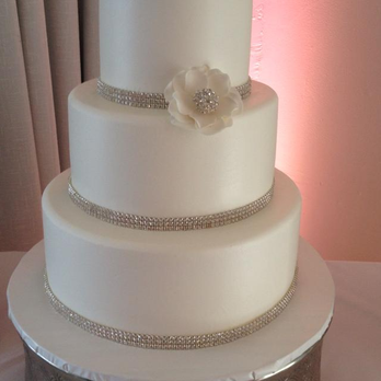 It's All About The Cake - White wedding cake with raspberry and bavarian cream filling, white butter cream frosting, sugar flowers for accent. Amazing! - Bakeries Near Me - Dana Point, California It's All About The Cake - White wedding cake with raspberry and bavarian cream filling, white butter cream frosting, sugar flowers for accent. Amazing! - Bakeries Near Me - Dana Point, California