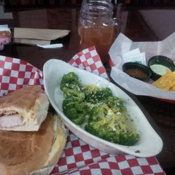 Papa's Tex Mex Smokehouse - Sandwich Cubano with a side of broccoli and complimentary chips and salas.