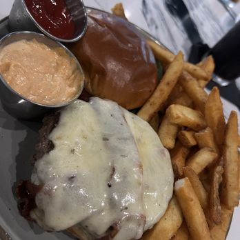 The Bradley Kitchen Bar - Melted cheese and candied bacon - sitting on the juicy burger. - New American Near Me - Fort Lauderdale, Florida The Bradley Kitchen Bar - Melted cheese and candied bacon - sitting on the juicy burger. - New American Near Me - Fort Lauderdale, Florida