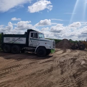 Holly Tree Landscaping & Retaining Walls - a dump truck and a tractor - Landscaping Near Me Holly Tree Landscaping & Retaining Walls - a dump truck and a tractor - Landscaping Near Me