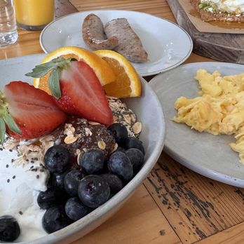 Chez Genèse - Multigrain bowl with a side of two scrambled eggs and an apple chicken sausage - French Near Me - Greensboro, North Carolina Chez Genèse - Multigrain bowl with a side of two scrambled eggs and an apple chicken sausage - French Near Me - Greensboro, North Carolina