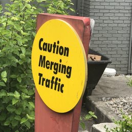 a caution merging traffic sign