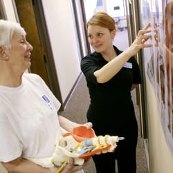 Spinal Dynamics of Wisconsin - Physical Therapist Meg Gogin helps educate a patient at our clinic