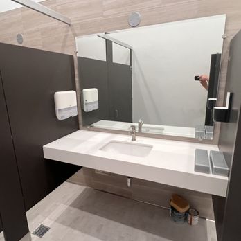 Credo Construction - a bathroom with a sink and a mirror - General Contractors Near Me Credo Construction - a bathroom with a sink and a mirror - General Contractors Near Me