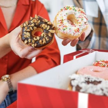 Shipley Do-Nuts - a woman holding a box of donuts - Donuts Near Me - Austin, Texas Shipley Do-Nuts - a woman holding a box of donuts - Donuts Near Me - Austin, Texas