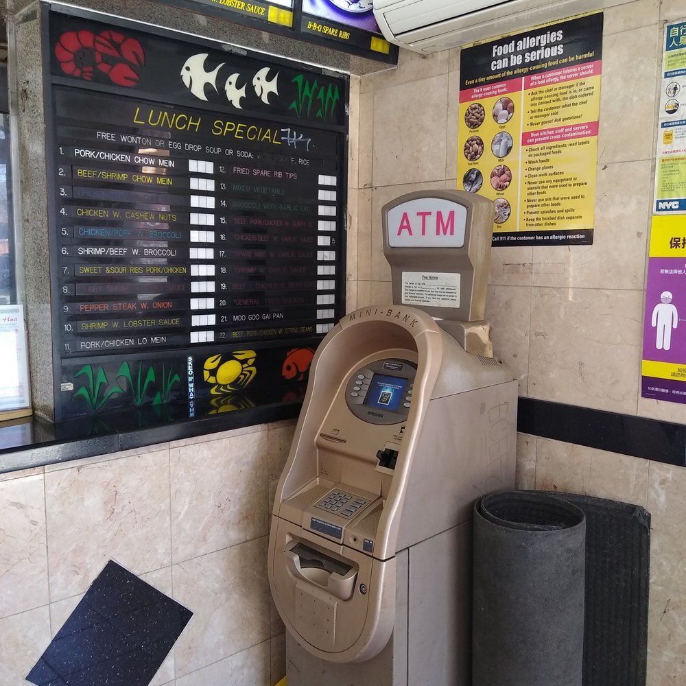 Wing Hua - an atm machine in a subway station - Chinese Near Me - Brooklyn, New York