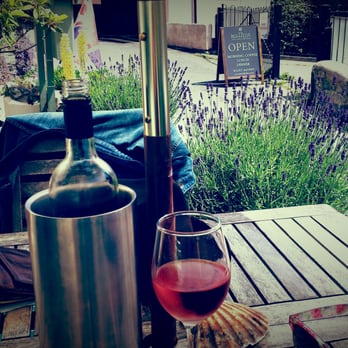 Millside Restaurant - It was a very sunny day, so obviously we had to have some rose! Charming little garden beside the table as well. - British Near Me - Lyme Regis, DOR