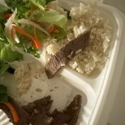 Charbroiled meat, steamed rice dish. More like slivers of meat Charbroiled meat, steamed rice dish. More like slivers of meat