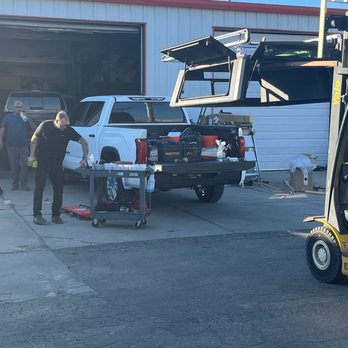 Topper Town - Staff installing new top Tobias Handyman - Auto Parts & Supplies Near Me - Albuquerque, New Mexico