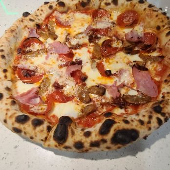 Terra Mare - Meat lovers' pizza looks promising straight out of the gas fired oven. - Pasta Shops Near Me - Wheaton, Maryland Terra Mare - Meat lovers' pizza looks promising straight out of the gas fired oven. - Pasta Shops Near Me - Wheaton, Maryland