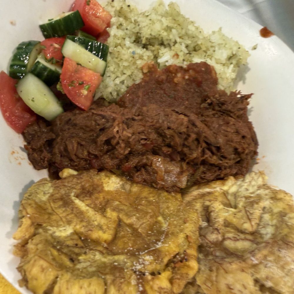 Illumination’s Minion Cafe - Ropa vieja with tostones and some pretty decent rice. Second best thing to eat after the Mac n cheese in my humble opinion. - New American Near Me - Orlando, Florida Illumination’s Minion Cafe - Ropa vieja with tostones and some pretty decent rice. Second best thing to eat after the Mac n cheese in my humble opinion. - New American Near Me - Orlando, Florida