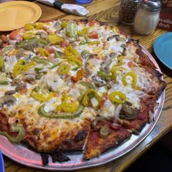 Family thin crust Vegetarian Special, minus olives, add banana peppers