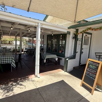 The Gilbert House - 6/23/26 entry area. Front patio dining area with fans & misters. Too hot for my group on 100+ degree day in AZ. - New American Near Me - Gilbert, Arizona