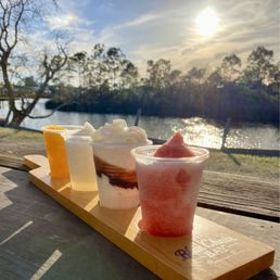 Daiquiri flight: mango, Pina colada, bushwhacker, and Miami vice Daiquiri flight: mango, Pina colada, bushwhacker, and Miami vice