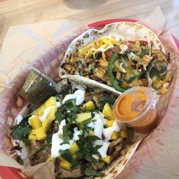 Torchy's Tacos - Brushfire Taco(left) and Chicken Fajita(right) - Tex-Mex Near Me - Houston, Texas Torchy's Tacos - Brushfire Taco(left) and Chicken Fajita(right) - Tex-Mex Near Me - Houston, Texas
