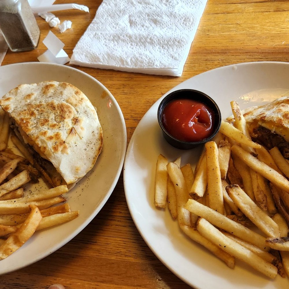 Sharing a quesadilla burger and served on 2 plates instead of bringing out an extra plate! Sharing a quesadilla burger and served on 2 plates instead of bringing out an extra plate!
