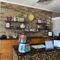 European Image Tanning Center - Front Desk & lotion display