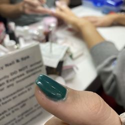 NOVELTY NAIL & SPA - When he was "done" with my nails they were a mess, green all over my hands and all over the edges of my nails.