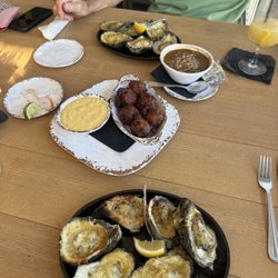 Barometer Waterfront Grill - Che grilled oysters, conch fritters , gumbo