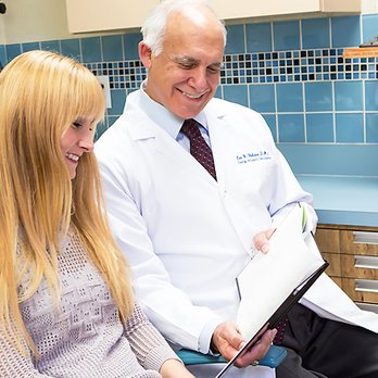 Sheldon & Furtado - Dr. Lee Sheldon educating a patient on a procedure. - Periodontists Near Me - Melbourne, Florida Sheldon & Furtado - Dr. Lee Sheldon educating a patient on a procedure. - Periodontists Near Me - Melbourne, Florida