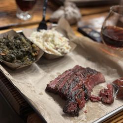 Intrinsic Smokehouse & Brewery - Barbecue pastrami with Cole slaw and turnip greens.