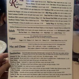 The menu includes Creole Gumbo, Black Bean Soup, Popcorn Shrimp, and Crabcakes, with various salads, fajitas, and sandwiches, emphasizing Cajun and Creole cuisine.