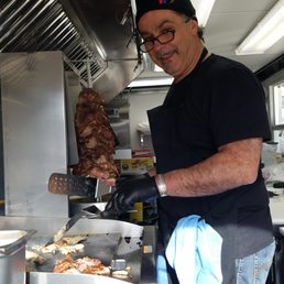 Chef Michael at work on our chicken gyros. Chef Michael at work on our chicken gyros.