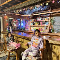 Tiki Bar fun! 2 juice boxes please!  Pina coladas and Mai Tais for adults only