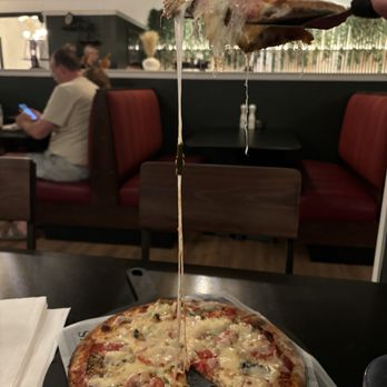 Scuola Pizza - Look at that cheese pull! - Pizza Near Me - Gainesville, Florida