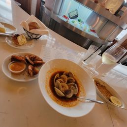 During happy hour from 4-6: Steamed clams (7 count), coconut shrimp (5 count), $6 chardonnay During happy hour from 4-6: Steamed clams (7 count), coconut shrimp (5 count), $6 chardonnay