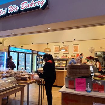 Mei Wa Bakery - a woman standing in front of the counter - Bakeries Near Me - Kent, Washington Mei Wa Bakery - a woman standing in front of the counter - Bakeries Near Me - Kent, Washington