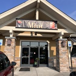 Mint - Outside entrance with plenty of parking in the lot.