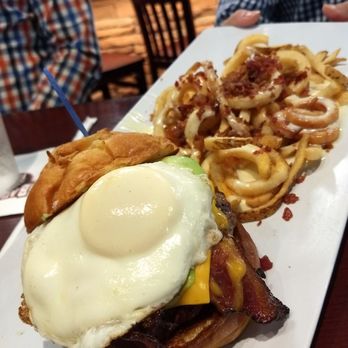 Baumhower's Victory Grille - Hangover Burger - Applewood-smoked bacon, American cheese, fried egg, fresh avocado, onion bun Remember to tell them how you want your egg! - Sports Bars Near Me - Mobile, Alabama Baumhower's Victory Grille - Hangover Burger - Applewood-smoked bacon, American cheese, fried egg, fresh avocado, onion bun Remember to tell them how you want your egg! - Sports Bars Near Me - Mobile, Alabama