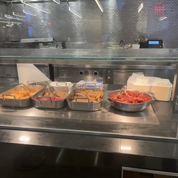 Studio 9C - the food being prepared in the kitchen - Food Court Near Me - New York, New York